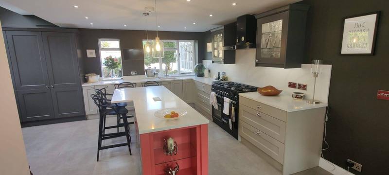 Large open-plan kitchen with a quartz-topped island, range cooker and bar seating