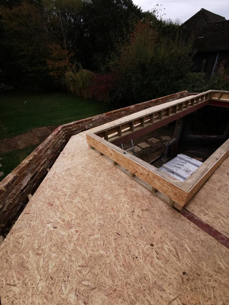 New flat roof deck with a timber upstand framed for a large rooflight