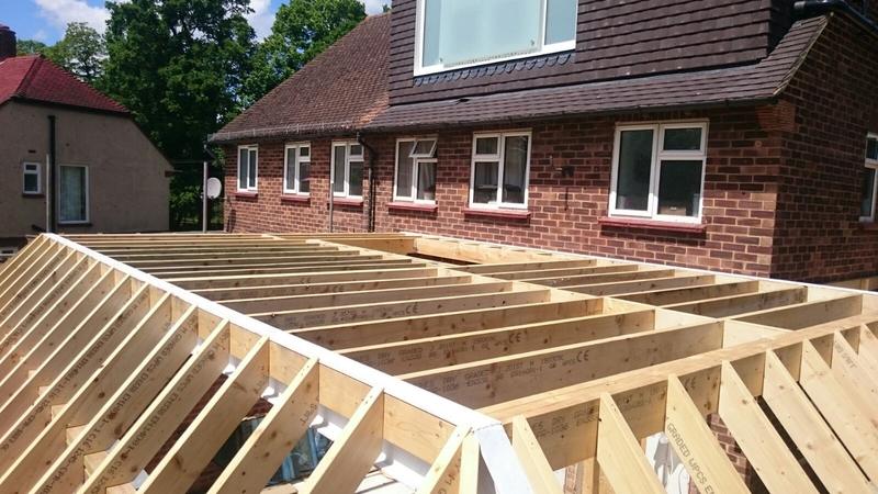 New timber joists spanning a large rear extension on a brick bungalow