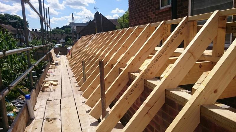 Newly cut roof rafters in place on a rear extension