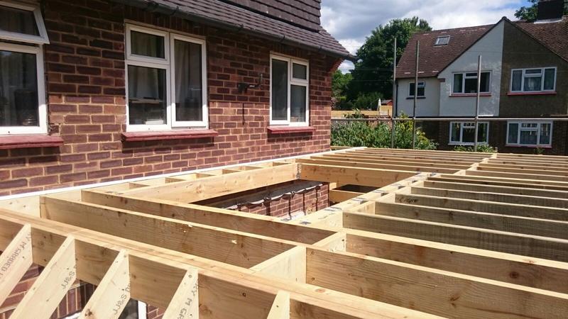 Rear extension at joist stage with new brickwork on a 1930s bungalow